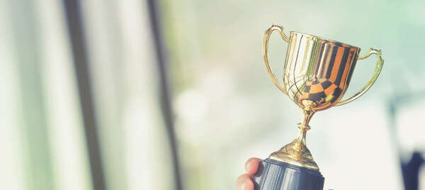 A cup held by a hand