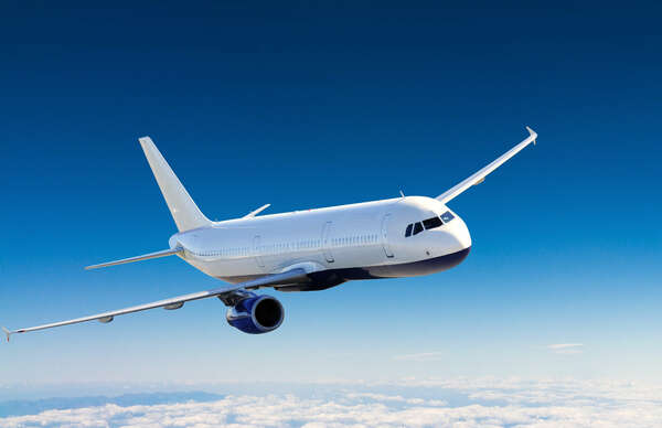 Flying plane in a blue sky