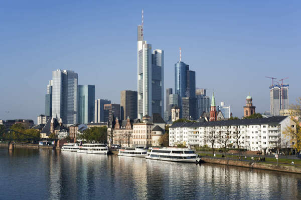 skyscrapers at financial district, Main river and tourist boats at Frankfurt