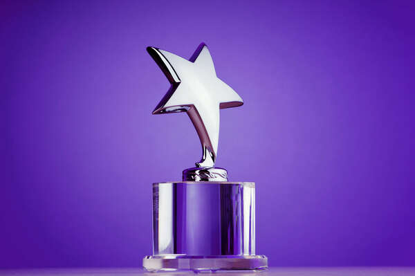 Award on a purple wall