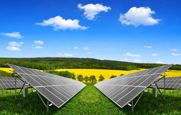 Spring landscape with solar energy panels
