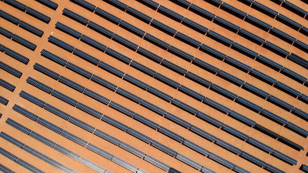 Solar panels field (solar cell) from above. Alternative energy, ecology power conservation concept. Aerial view