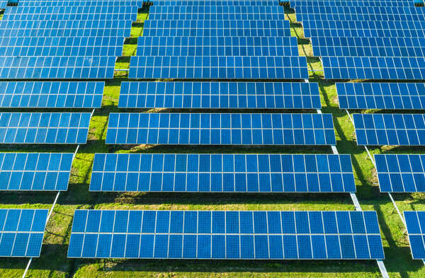 Aerial view of Solar Panels Farm (solar cell) with sunlight