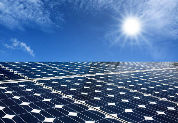 Solar panels produce energy from the sun with blue sky