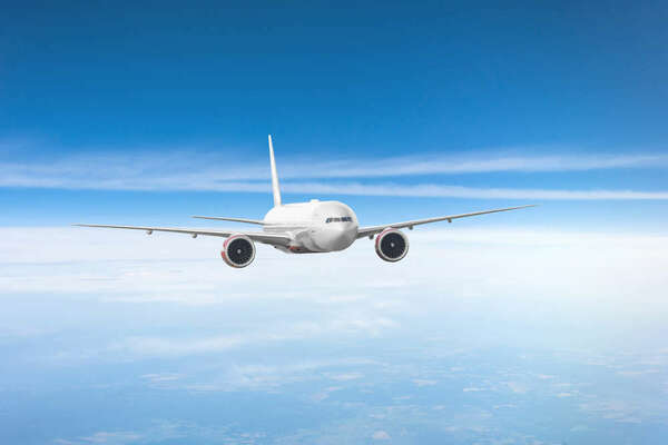 Passenger plane flies in the sky, performing flight 