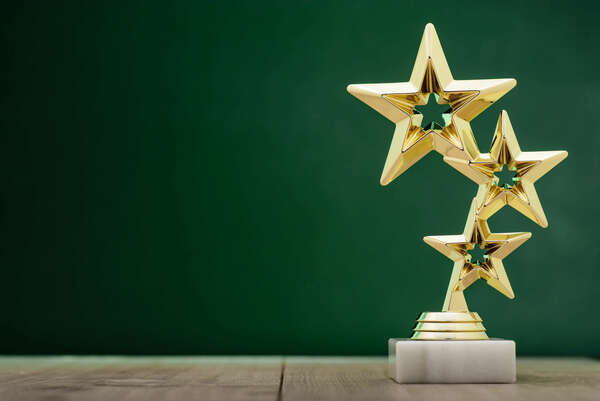  3 stars award on green background