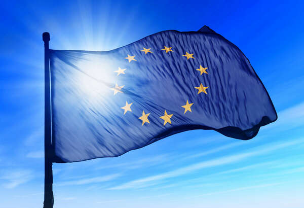 Flag of European Union in a blue sunny sky 