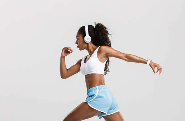 sportive woman wearing earbud and smartwatch