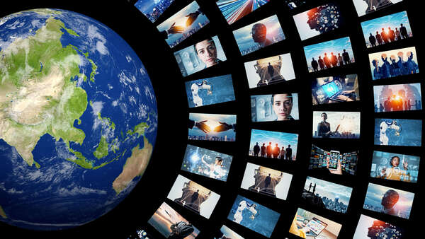 globe and wall of images on screens